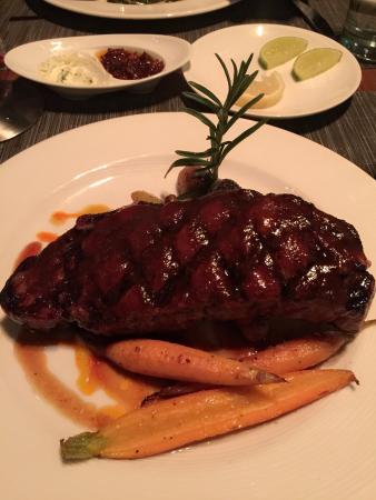 Altius signature dishes Wagyu Beef, Scallops, Foie Gras, Chocolate Bar, Heritage Breed Tomahawk Pork Chop, Chilean Seabass